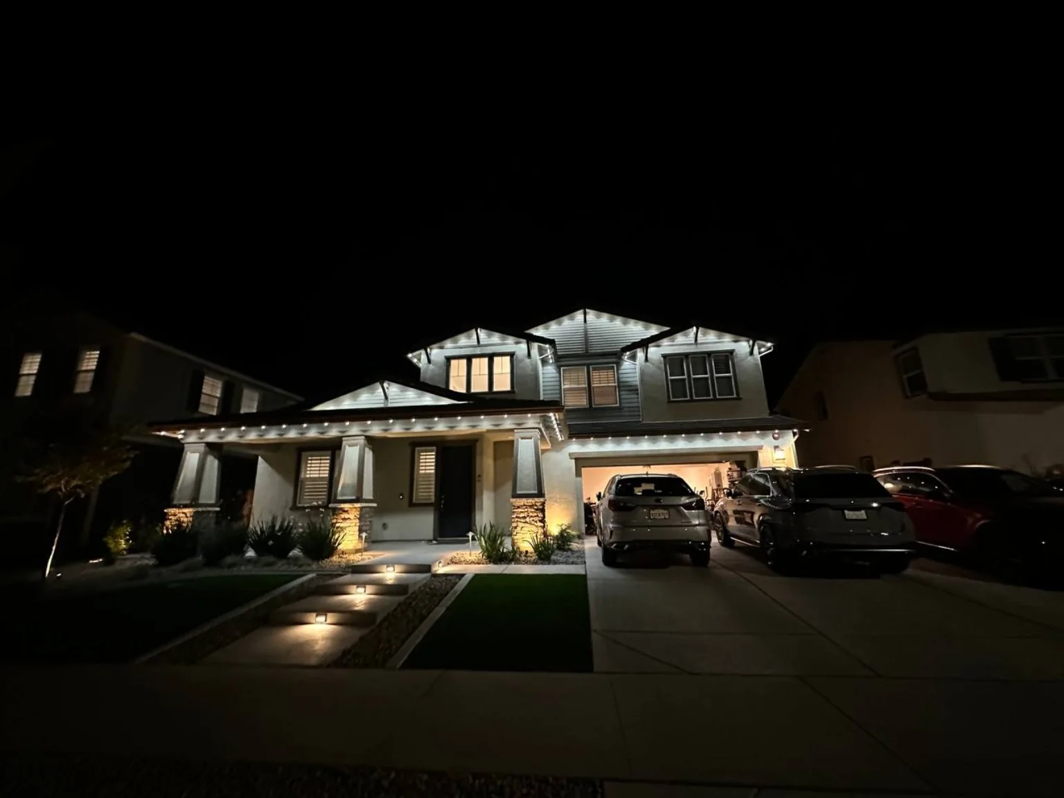 White roofline lighting on a home